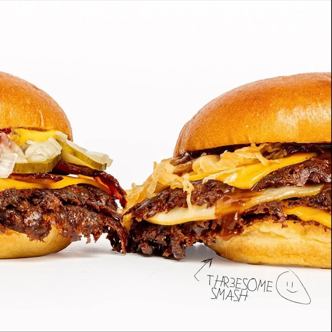 Double cheeseburgers with fries labeled Threesome Smash